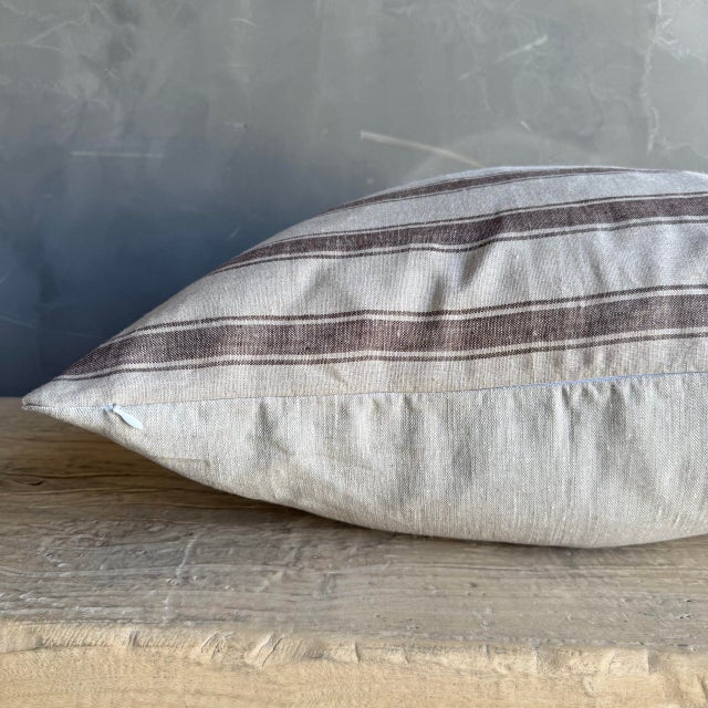 European ticking stripe pillow cover in brown and natural linen. Our pillows are constructed with the finest textiles from...