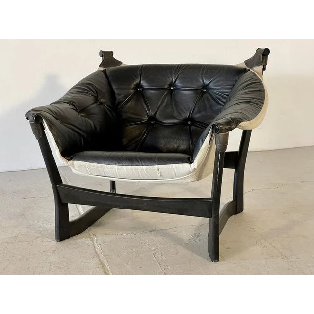 This beautiful armchair is in good, used condition. The leather is soft and not dry. A very nice piece of furniture.