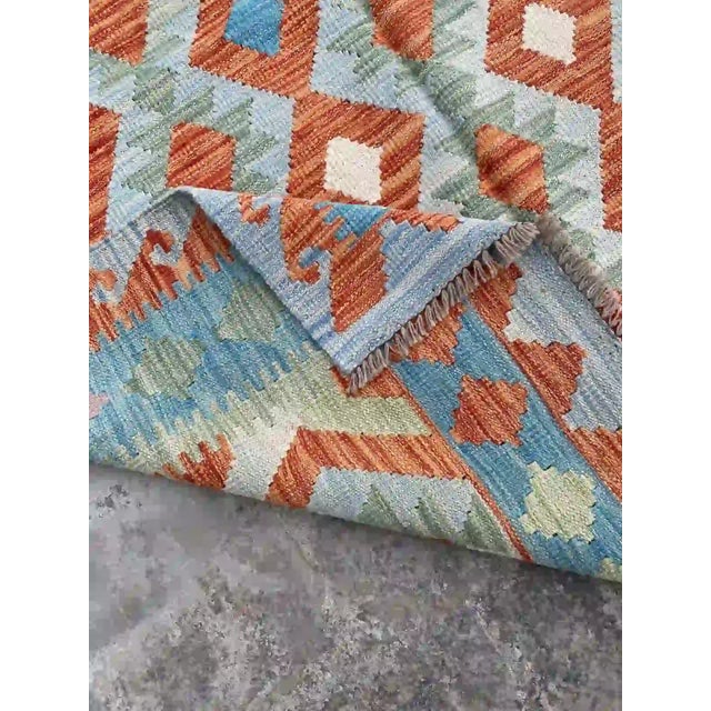 Textile Hand-Woven Afghan Kilim Rug | Vibrant Geometric Design in Blue and Orange For Sale - Image 7 of 11