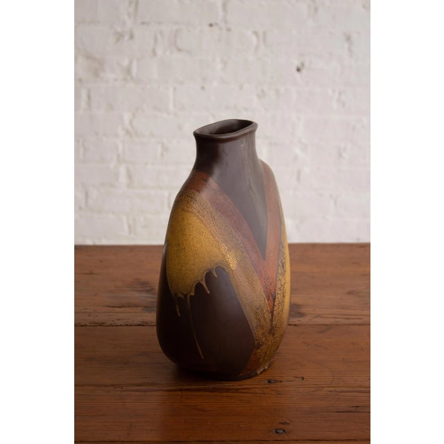 Royal Haeger flask form silhouette vase from the "Earth Wrap" series. Brown base coat with abstract textured yellow and...