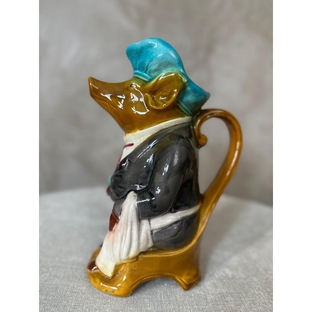 Charming antique Saint-Germain earthenware pitcher from the 1920s depicting a pig dressed as a brasserie waiter. This...