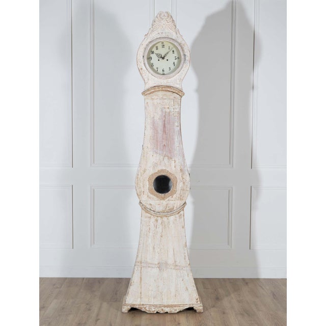Unlock the quiet poetry of time with this rare genuine Mora clock from Northern Sweden, crafted circa 1820. Fashioned from...