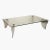 A vintage rectangular coffee table in glass and aluminium. This piece is attributed to the mentioned designer/maker. It...