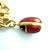 Early 21st Century Fabergé, 18k Yellow Gold and Enamel Egg Charm Bracelet For Sale - Image 5 of 7