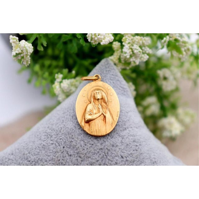19.2k Gold Our Lady of the Immaculate Conception Pendant, in Worn conditions. Designed 1980 to 1989