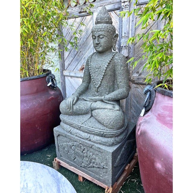 Vintage beautiful solid hand carved stone sitting large Buddha statue. Buddha is sitting atop a block pedestal with...