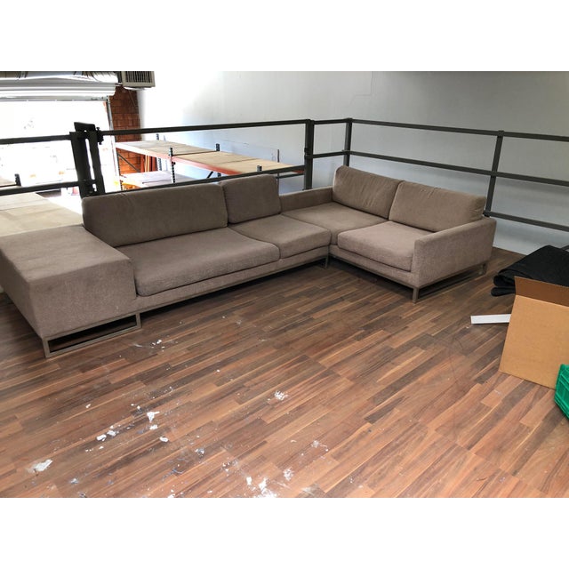 Such an incredibly cool silhouette to this sectional sofa which is in the style of Ligne Roset and B&B Italia. Two...