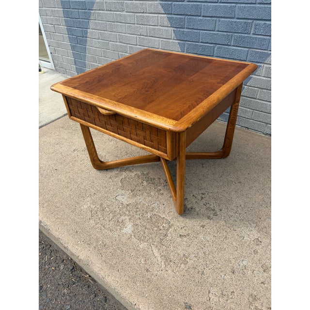 A beautifully crafted mid-century modern side table from the Perception collection by Lane Furniture, produced in the...