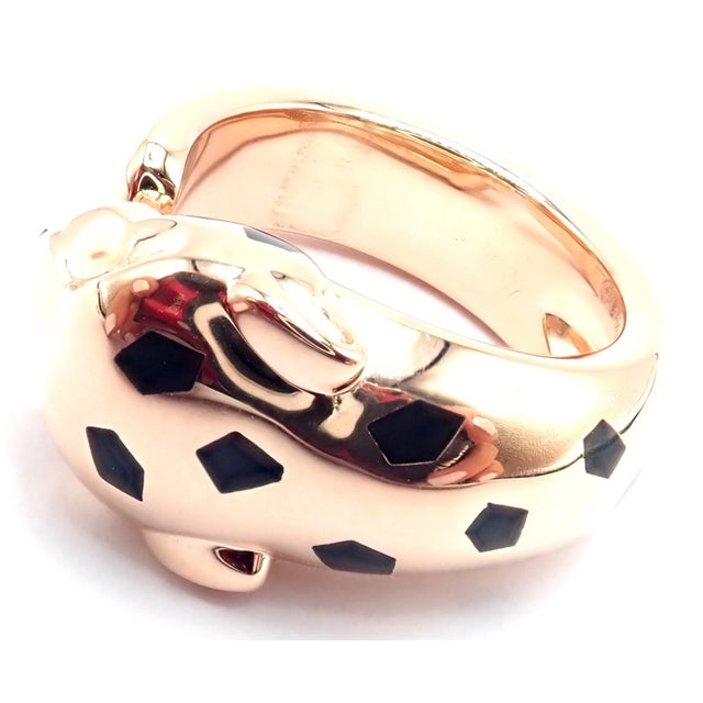 The Cartier Panther Panthère 18k Gold Lacquer Tsavorite Ring. *This ring comes with Cartier box and certificate of...