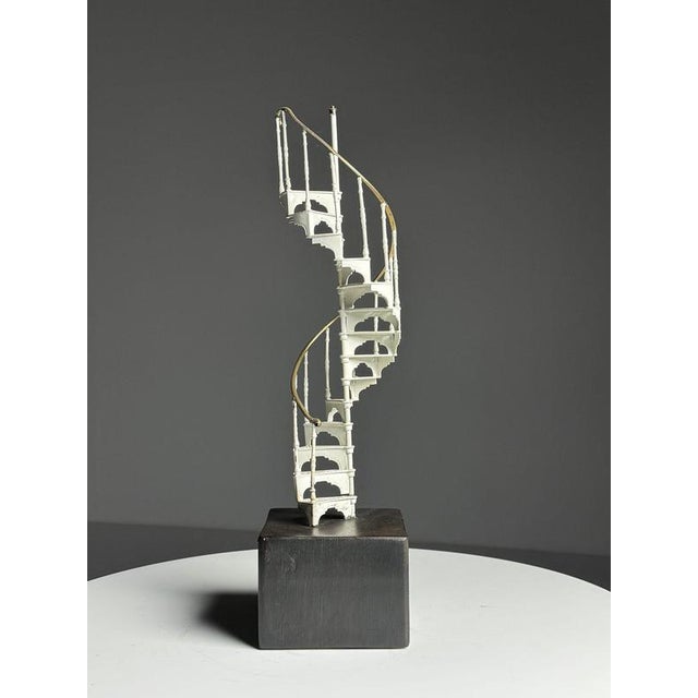 A lovely scale model staircase. Spiral staircase. Made of white metal. Presumably mid- to late 20th century. It stands on...