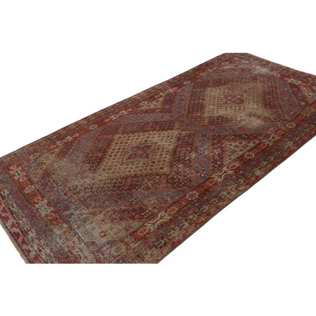 Hand-knotted in wool, this 5x11 vintage Samarkand style rug, circa 1960-1970, has been inspired by antique Khotan...