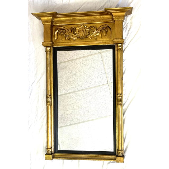 Early 20th century Italian carved wood pier mirror. It features a double baluster column design with a center foliage and...