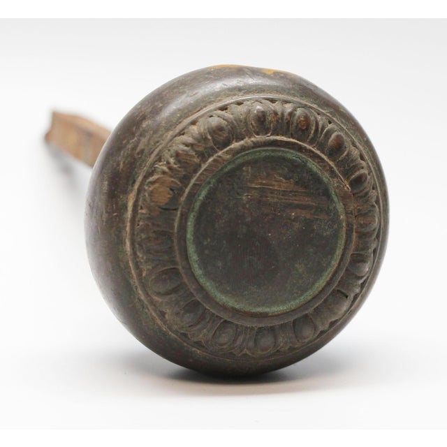 Greek bronze knob with a concentric egg and dart design. It is part of the M-15550 group. This knob is attached to a 0.375...
