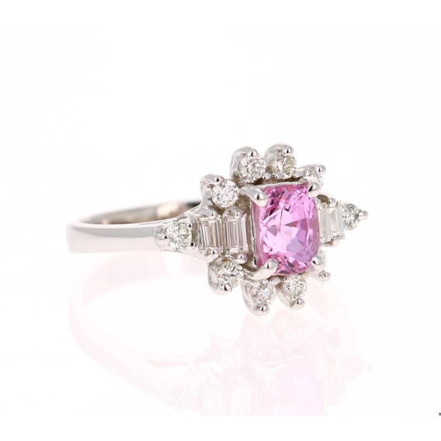 This beautiful ring has a Oval Cut Pink Sapphire that weighs 1.12 Carat. The Pink Sapphire has a beautiful vivid pink...