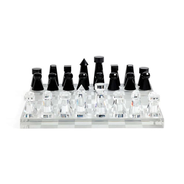 Handmade Crystal Chess Set A game, recast as a small piece of sculpture. This handmade crystal chess set is pure modern...