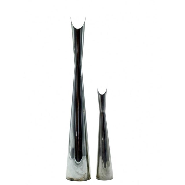 A set of two ‘Cardinale’ vases in silver-plated metal, designed by Lino Sabattini for Christofle. These sculptural pieces...