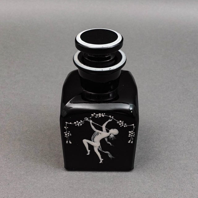 Bohemian Mary Gregory Enamel Black Amethyst Art Glass Bottle. Measures approximately 2 3/8" long, 2 3/8" wide, 4 5/8" high.