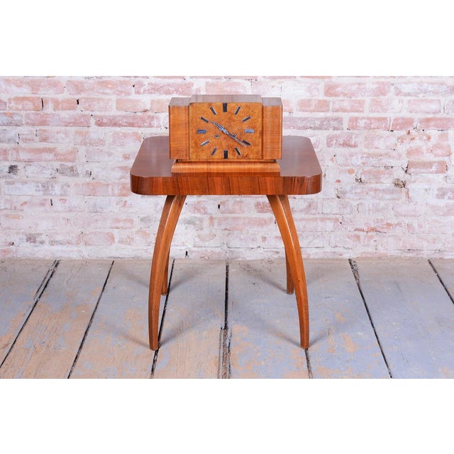 These table clocks are another excellent example of Czechoslovak horological design from the 1920s. The design follows a...