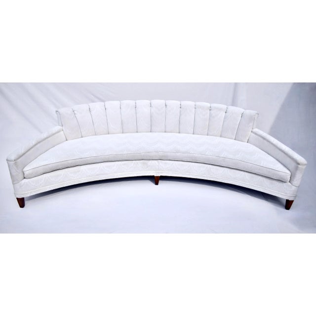 1960's Harvey Probber Crescent shaped curved sofa featuring custom channel back design with walnut legs reupholstered in...