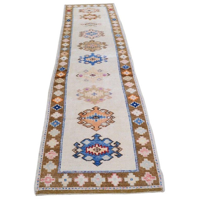 Hand-knotted with care using traditional rug-making techniques, this wool rug blends timeless craftsmanship with a modern...