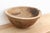 There is something deeply grounding about holding a vessel that was hewn by hand from a single block of wood. This antique...