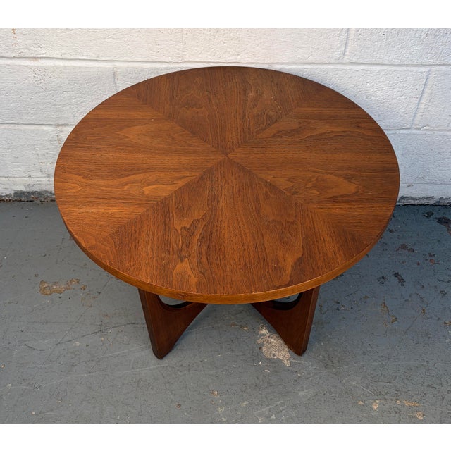 Attributed to Broyhill Brasilia Brutalist Mid-Century Round Walnut Side Table. Featuring clean lines and a simple, elegant...