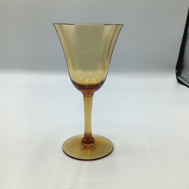 Pretty set of 7 amber crystal port glasses. These are older and are very elegant. I was unable to identify the maker.