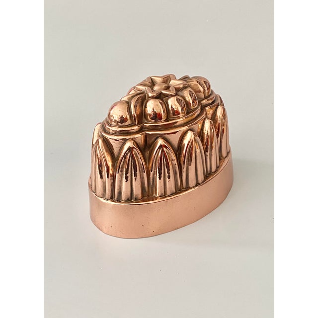 Offered is a lovely 19thc English copper jelly mold. This mold dates from the 1870's. This mold features rising columns of...
