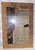 Nouveau hints in this antique wooden American wall mirror, leaf and vine motif with the original wavy floated mirror glass...