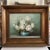 Vintage signed floral still life featuring white roses arranged in a turquoise vessel against a soft green-blue...