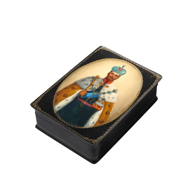 This exquisite Russian box features a hand-painted portrait of Tsar Nicholas II, the last Emperor of Russia, adorned with...