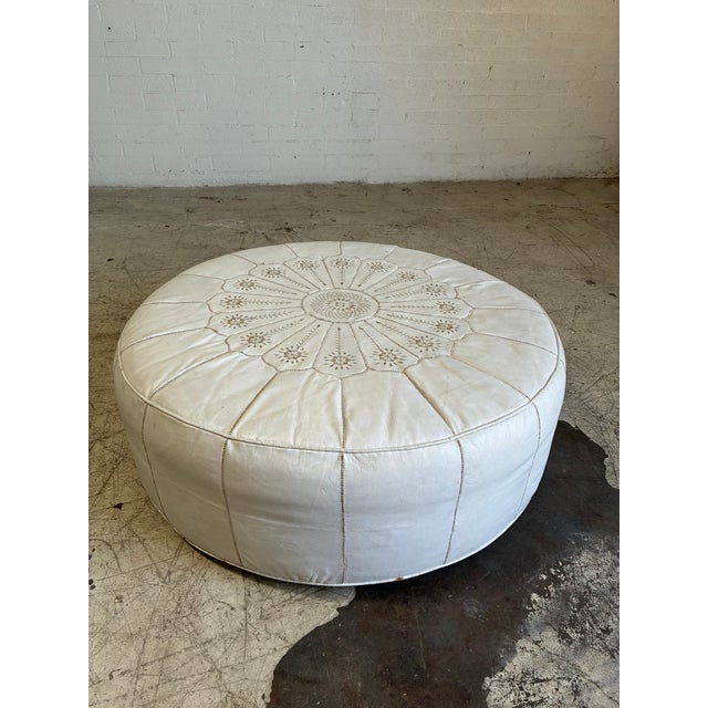 Vintage oversized white leather moroccan pouf ottoman, featuring smooth leather with an embroidered floral design. In...