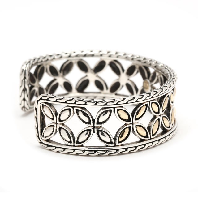 Circumference: 6.25 inches Width: 18 mm Weight: 25.1 dwts. / 39.1 grams Stamps "18k 925 JH" Kawung Collection SKU: B1307 A...