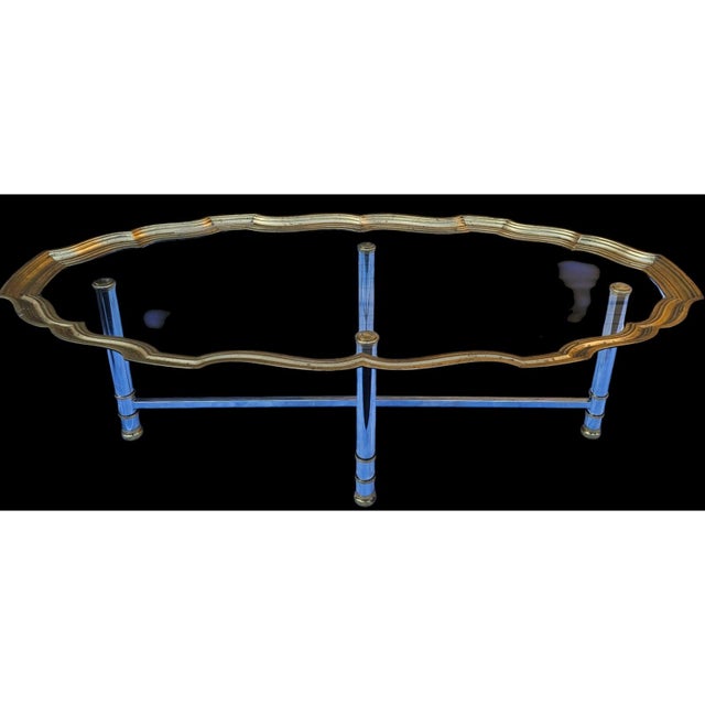 This Vintage Scalloped Brass and Polished Steel Chrome Cocktail Table is stunning and elegant, and the combination of a...