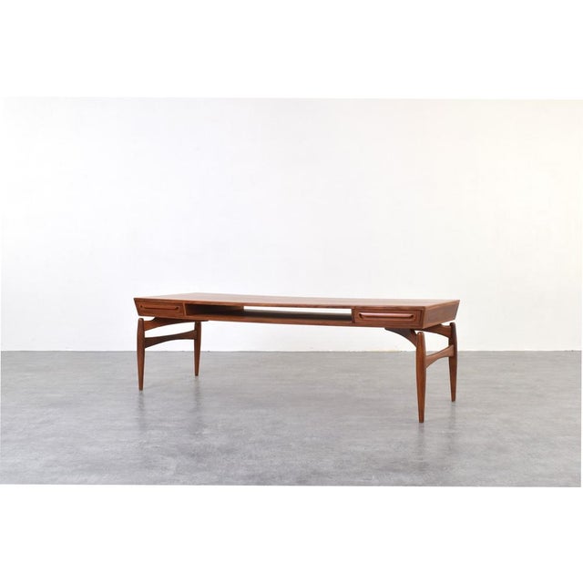 This teak coffee table was designed by Danish designer Johannes Andersen and manufactured in the 1960s by the Swedish...