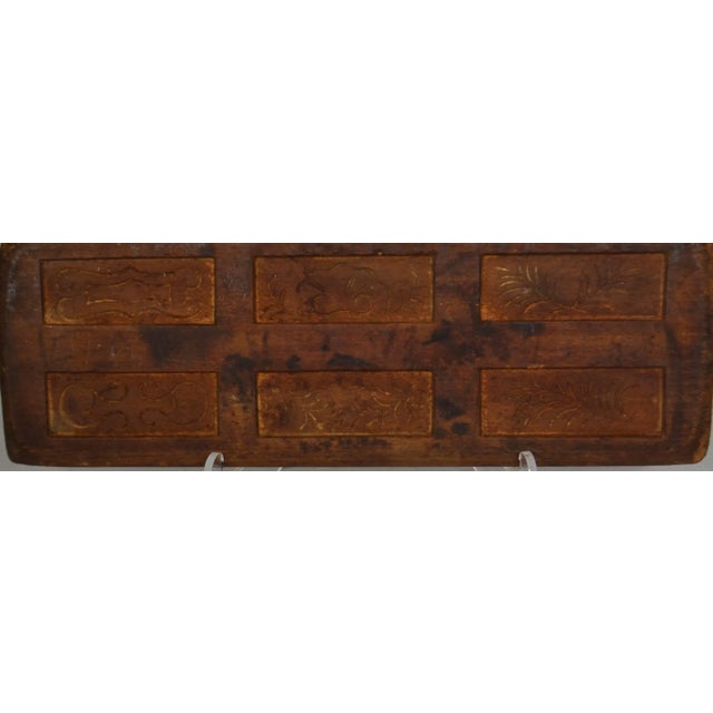 Wooden gingerbread mold (rectangle shapes with simple designs).