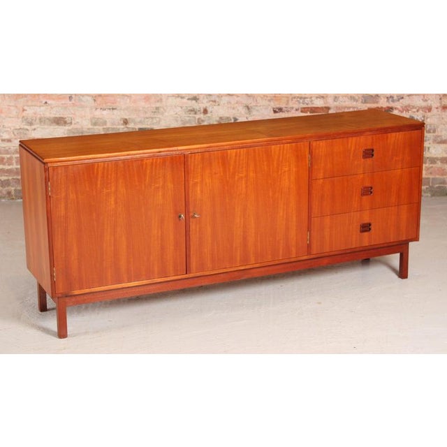 Danish mid century teak sideboard by aejm mobler, circa 1960s. Three drawers and 2 cabinet sections with lockable doors. 2...