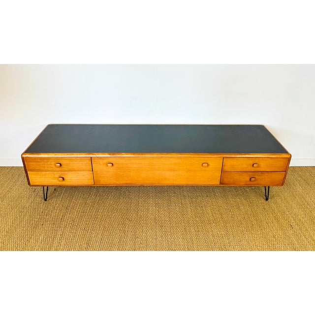 Magnificent vintage Scandinavian teak sideboard dating from the 1960s. Features four drawers and a central hinged door....