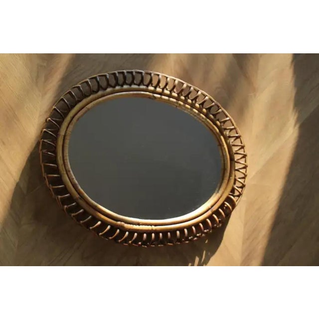 This very decorative mirror was made in Italy in 1960s. It is typical of this period design and is all original. It was...