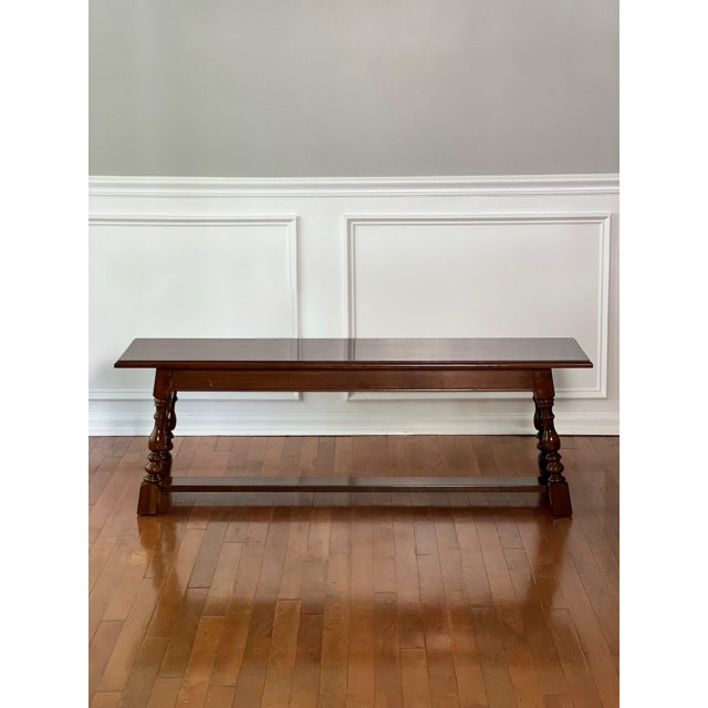 Country English style turned cherry wood bench with splayed legs by Harden Furniture, late 20th century. This wonderful...