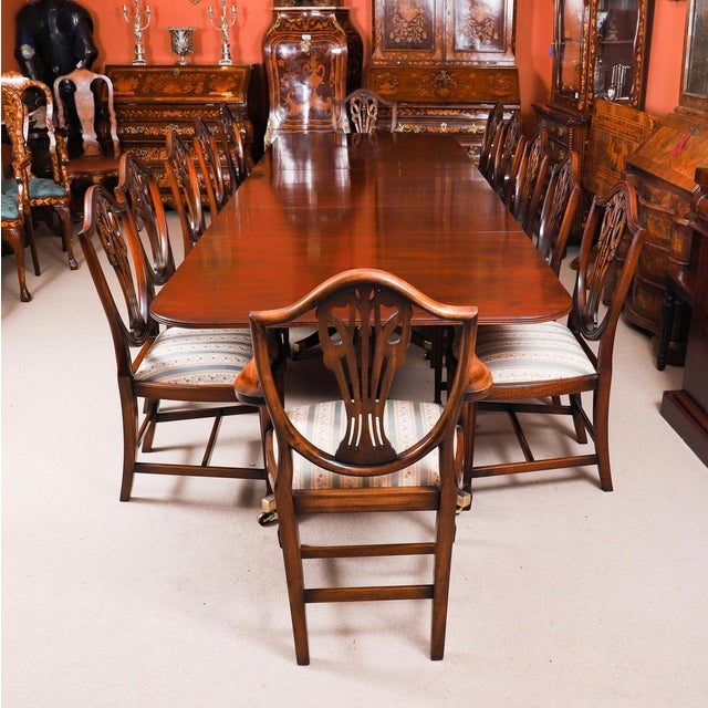 This is a fabulous Vintage Regency Revival dining table and twelve chairs by the master cabinet maker William Tillman,...