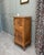 This small, tall antique walnut sideboard is distinguished by its narrow profile and decorative front. Likely dating from...