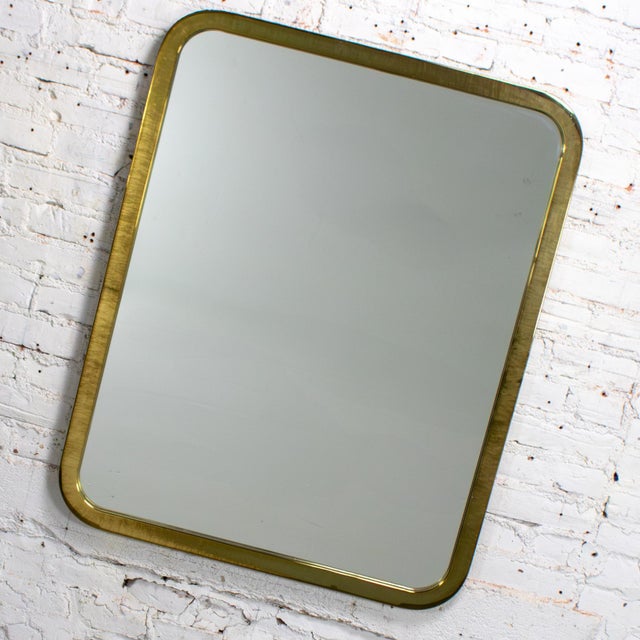 Fabulous vintage Modern wall mirror designed by Milo Baughman for Thayer Coggin composed of mirror inset in a brass...