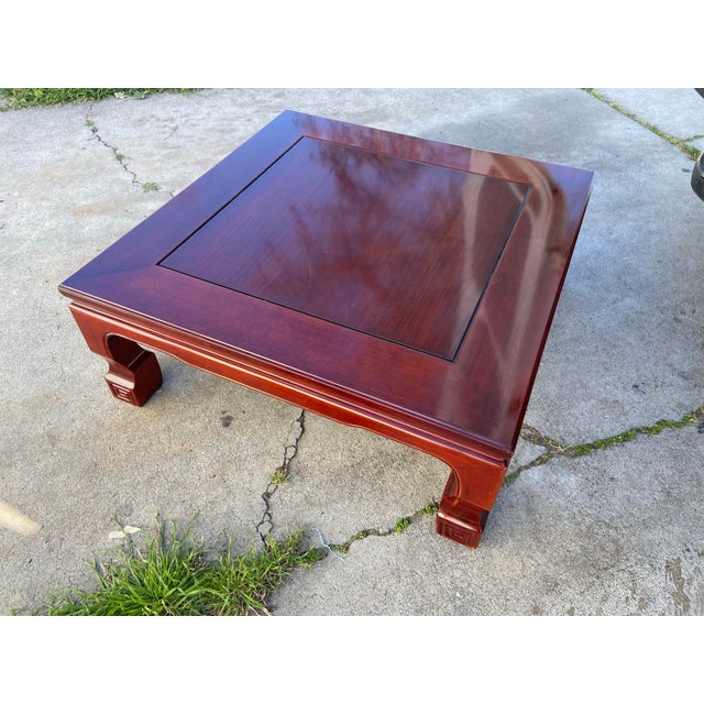 This is a Japanese low coffee table (hiradaku) crafted in rosewood, designed for use as a stand for flower arrangements,...