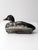 A striking antique hand-carved duck decoy with a sculptural silhouette and beautifully timeworn painted surface. Signed by...