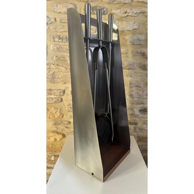 Superb vintage 1970s fireplace tool set in brushed aluminum, complete with brush, shovel, and poker. This chic and elegant...