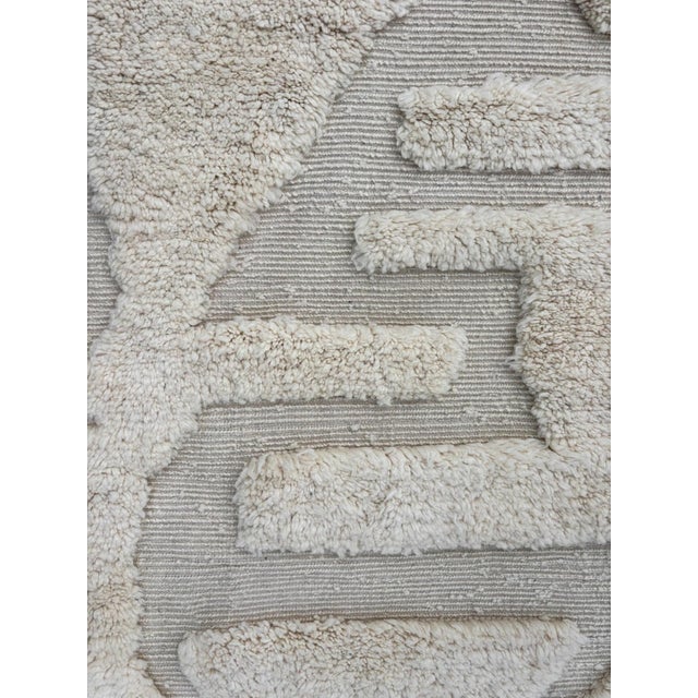 Bring the charm of Moroccan craftsmanship into your home with this stunning Beni Ouarain-style wool rug. Handwoven by...