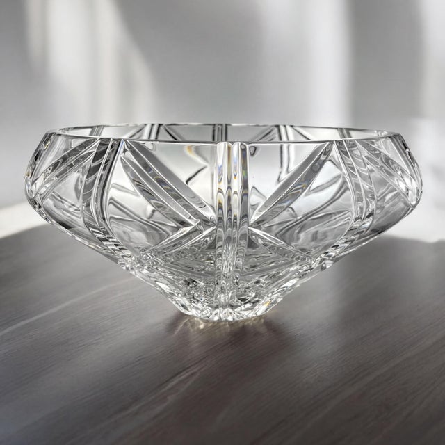Hand-crafted fine crystal centerpiece bowl with a distinctive bulb shape and impressive clarity. Measures 12 inches in...