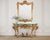 An elegant 18th century giltwood console or pier table crafted in the Italian Rococo period. The distinctive table...