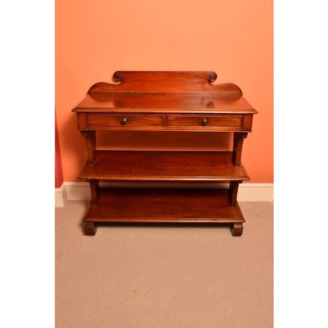 This is an antique Victorian mahogany serving table or buffet, circa 1850 in date. It is made from mahogany, has a moulded...